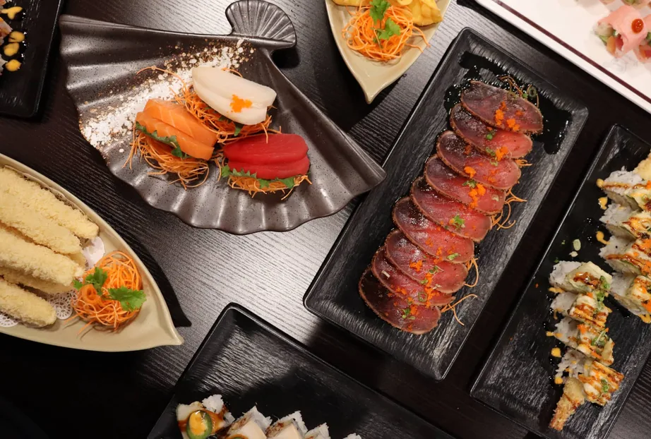 Assorted sushi rolls, sashimi and tempura spread