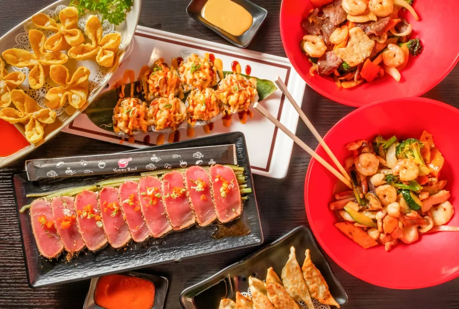 Asian takeout dishes arranged for a shared meal